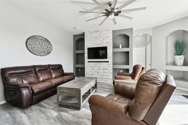 a kitchen with stainless steel appliances granite countertop a sink a stove and a microwave