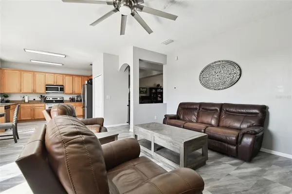 a kitchen with granite countertop white cabinets and stainless steel appliances