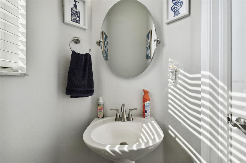 5707 Butterfield Street Riverview, FL 33578 - Photo 27 of 67 a bathroom with a sink and a mirror