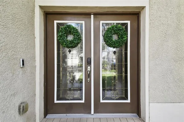 a living room with furniture a rug and a large window