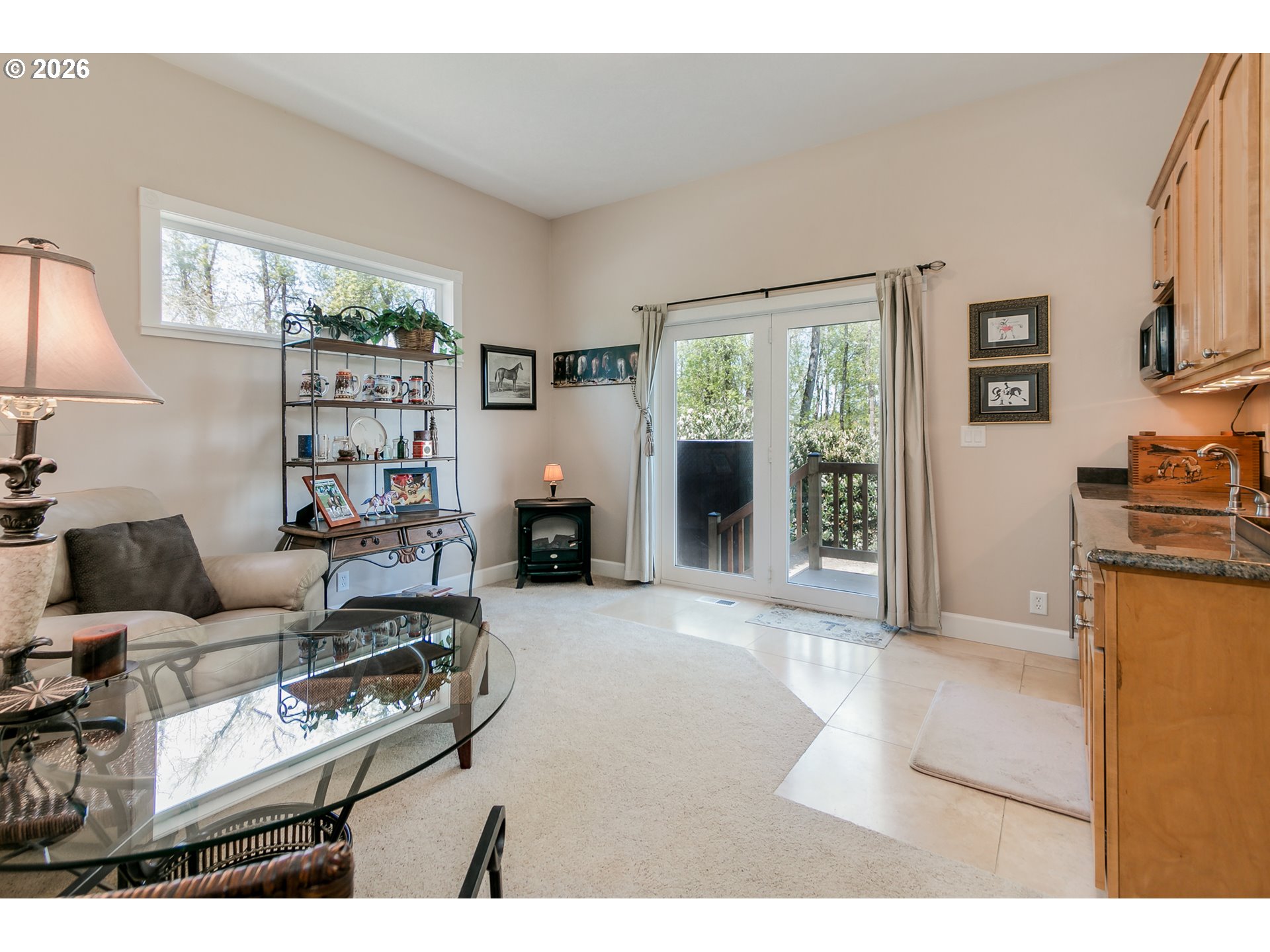 33391 Howe Lane Creswell, OR 97426 - Photo 22 of 40 a living room with furniture a large window and a flat screen tv