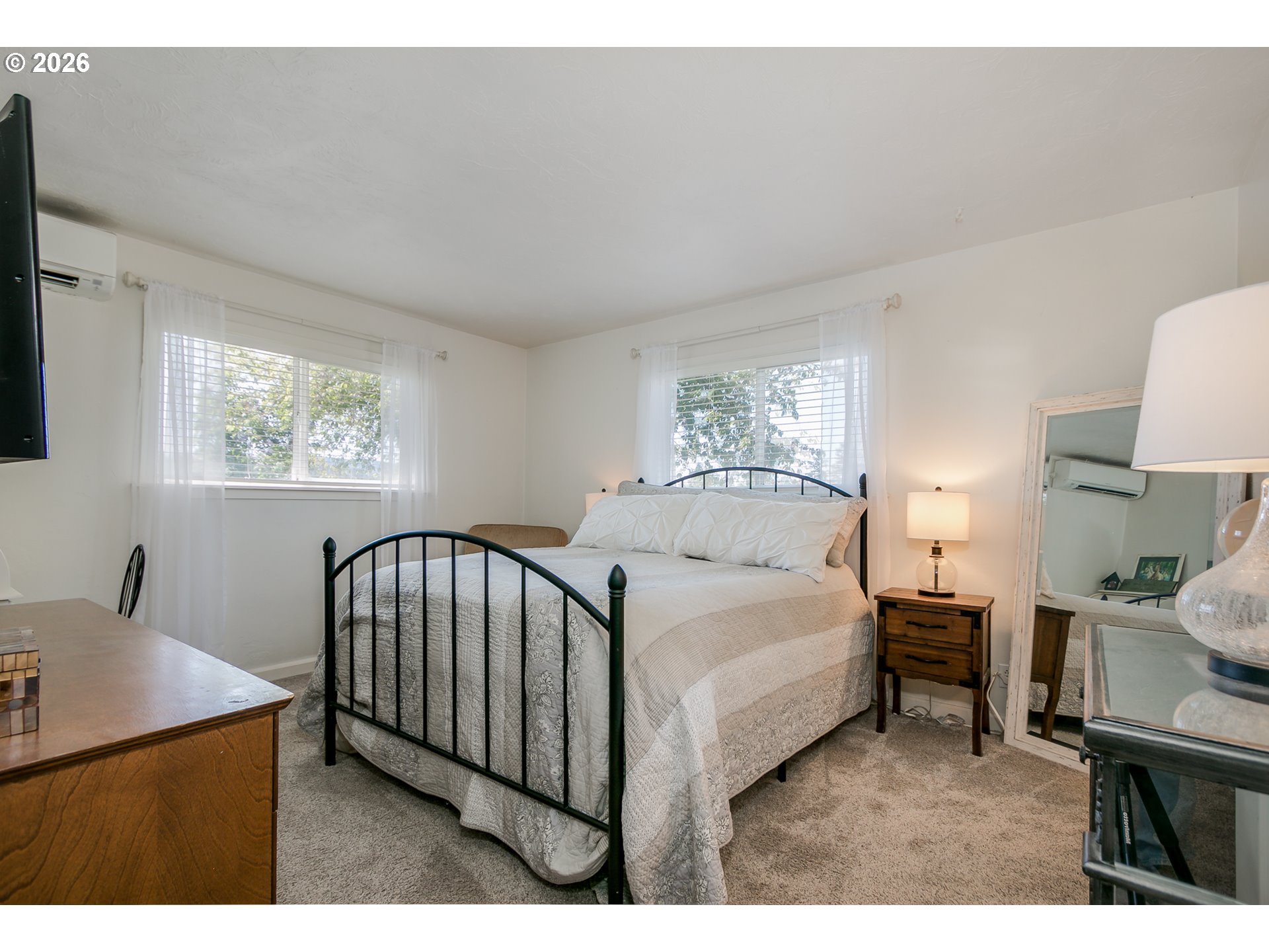 33391 Howe Lane Creswell, OR 97426 - Photo 28 of 40 a bedroom with a bed a table and painting