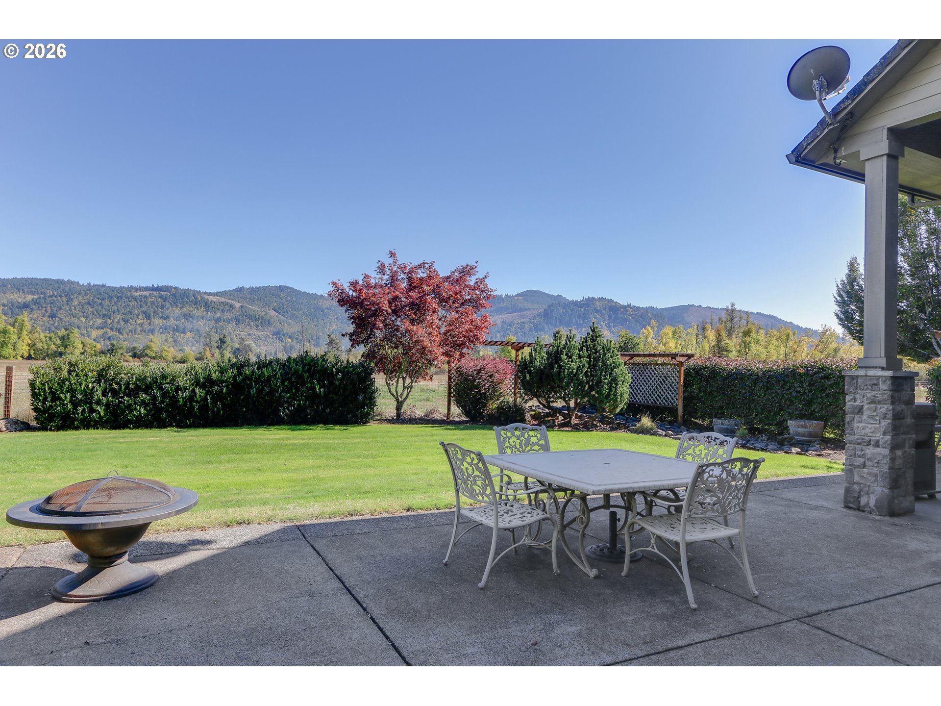 33391 Howe Lane Creswell, OR 97426 - Photo 37 of 40 a patio with a table and chairs