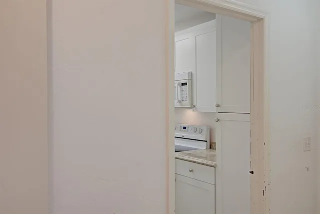 a kitchen with cabinets and appliances