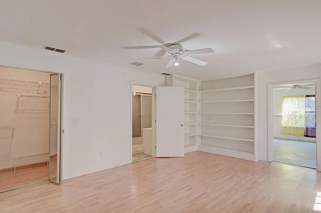 a view of storage and utility room with empty racks