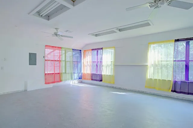 an aerial view of a house with a yard and garden