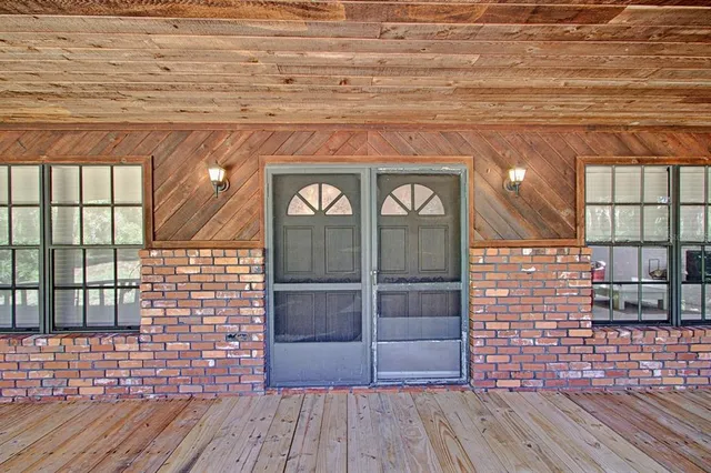 a front view of a house with a glass door