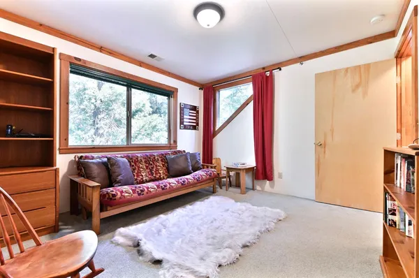 a backyard of a house with a tree