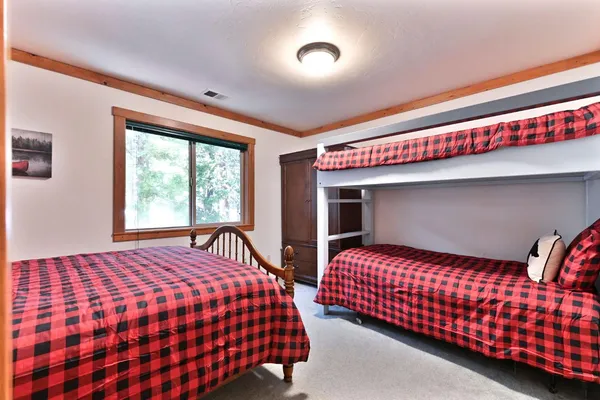 a backyard of a house with large trees and a house