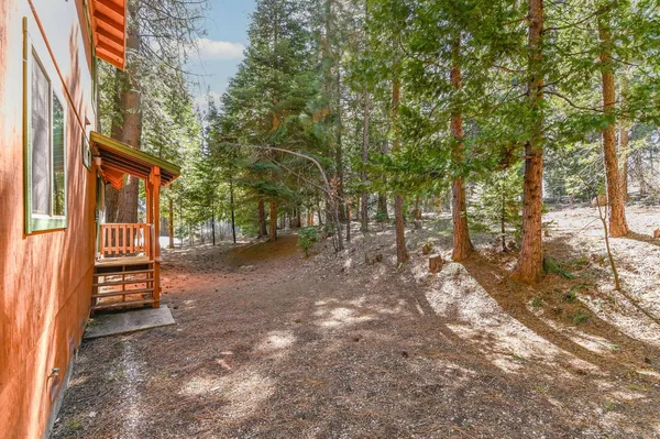 a view of a chairs and table on the wooden floor