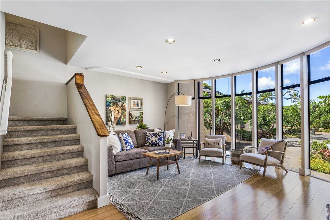 5432 Lower Honoapiilani Road, Unit B7 Lahaina, HI 96761 - Photo 3 of 27 a living room with furniture and a floor to ceiling window