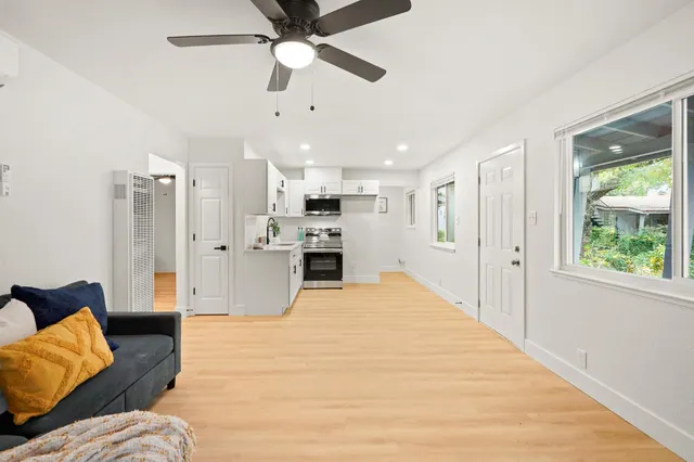 a large white bed in a white room