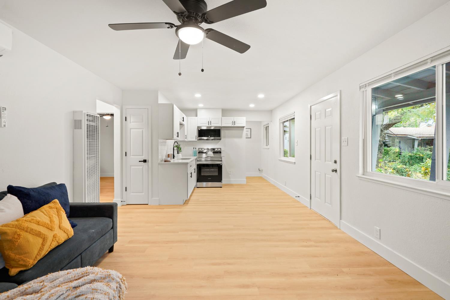 a large white bed in a white room