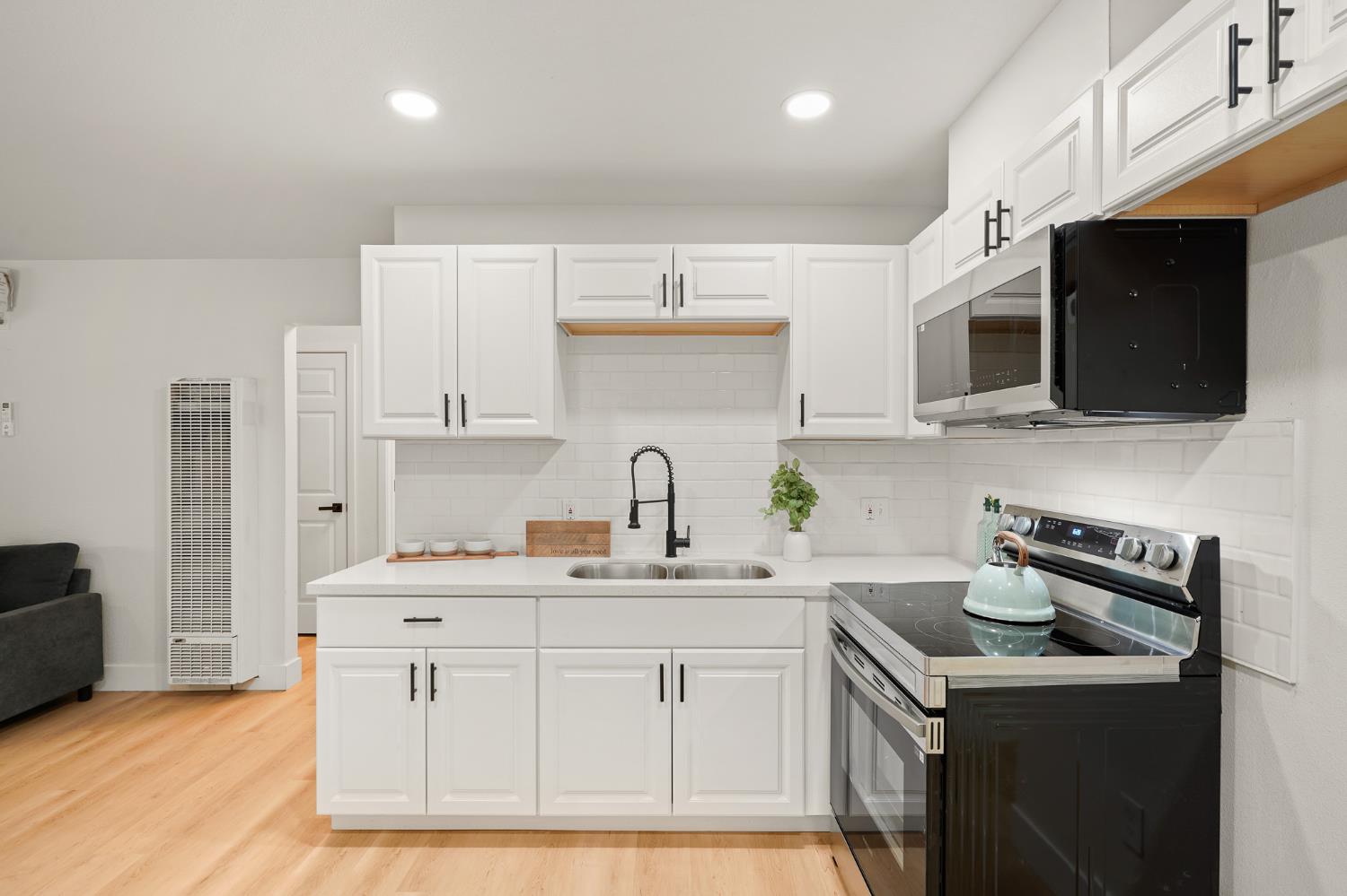 1719 West Swain Road, Unit A Stockton, CA 95207 - Photo 11 of 25 a kitchen with a sink stainless steel appliances and cabinets
