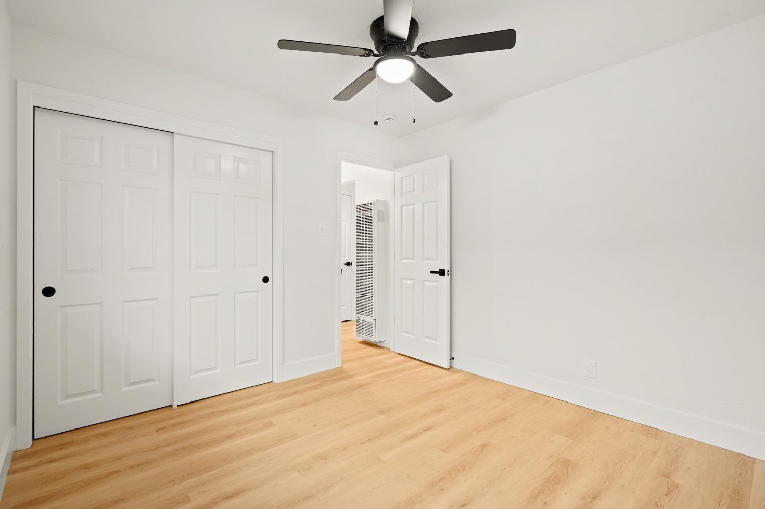 1719 West Swain Road, Unit A Stockton, CA 95207 - Photo 13 of 25 a view of empty room with wooden floor