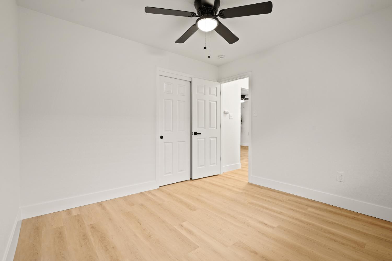 1719 West Swain Road, Unit A Stockton, CA 95207 - Photo 23 of 25 a view of empty room with wooden floor