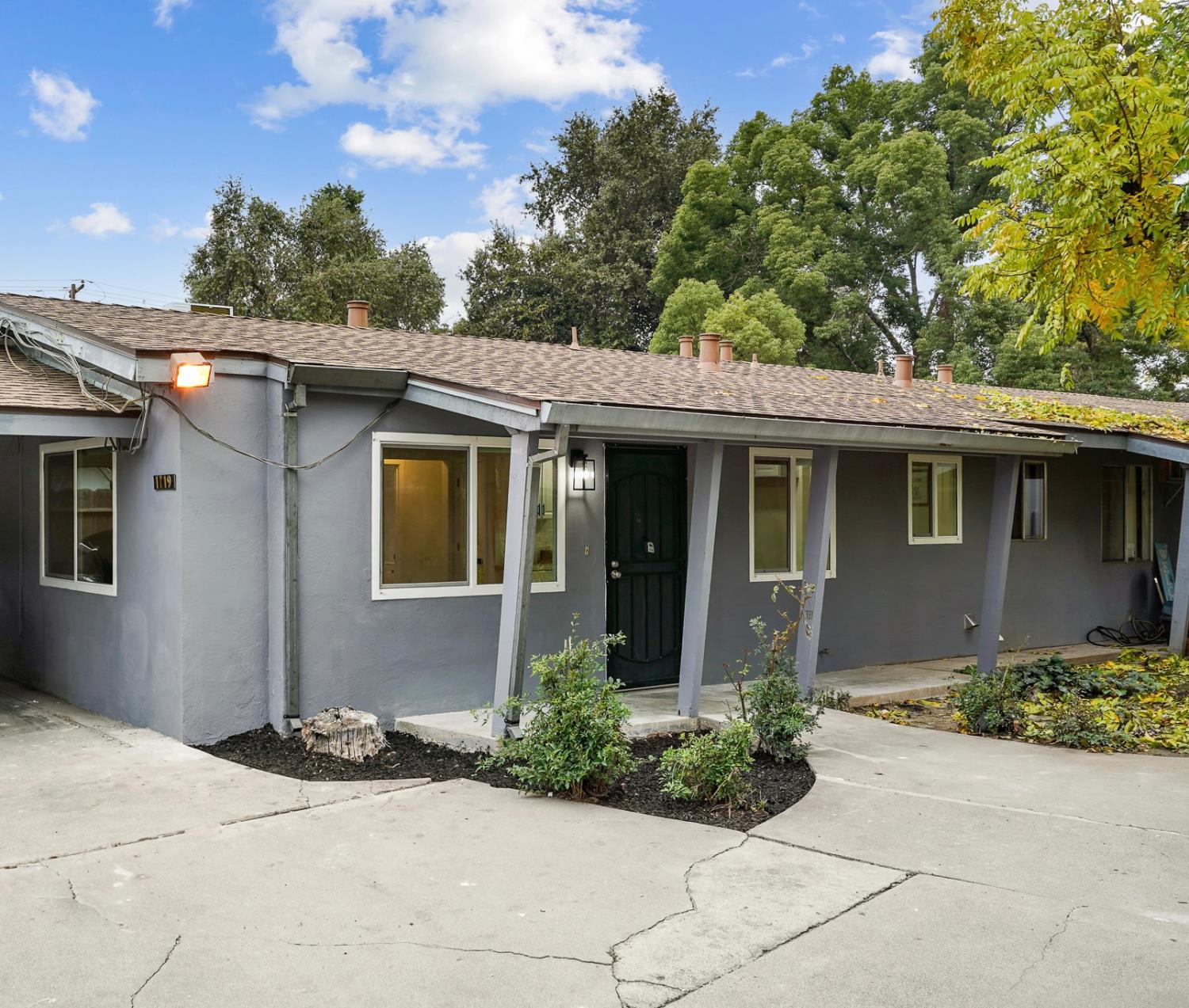 1719 West Swain Road, Unit A Stockton, CA 95207 - Photo 5 of 25 a front view of a house with a yard