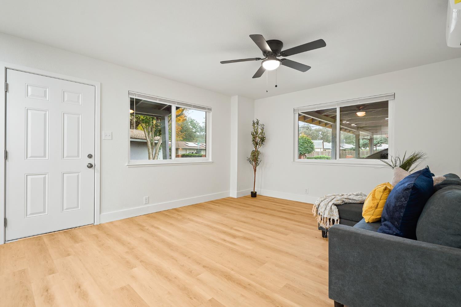 1719 West Swain Road, Unit A Stockton, CA 95207 - Photo 7 of 25 a living room with furniture and a window