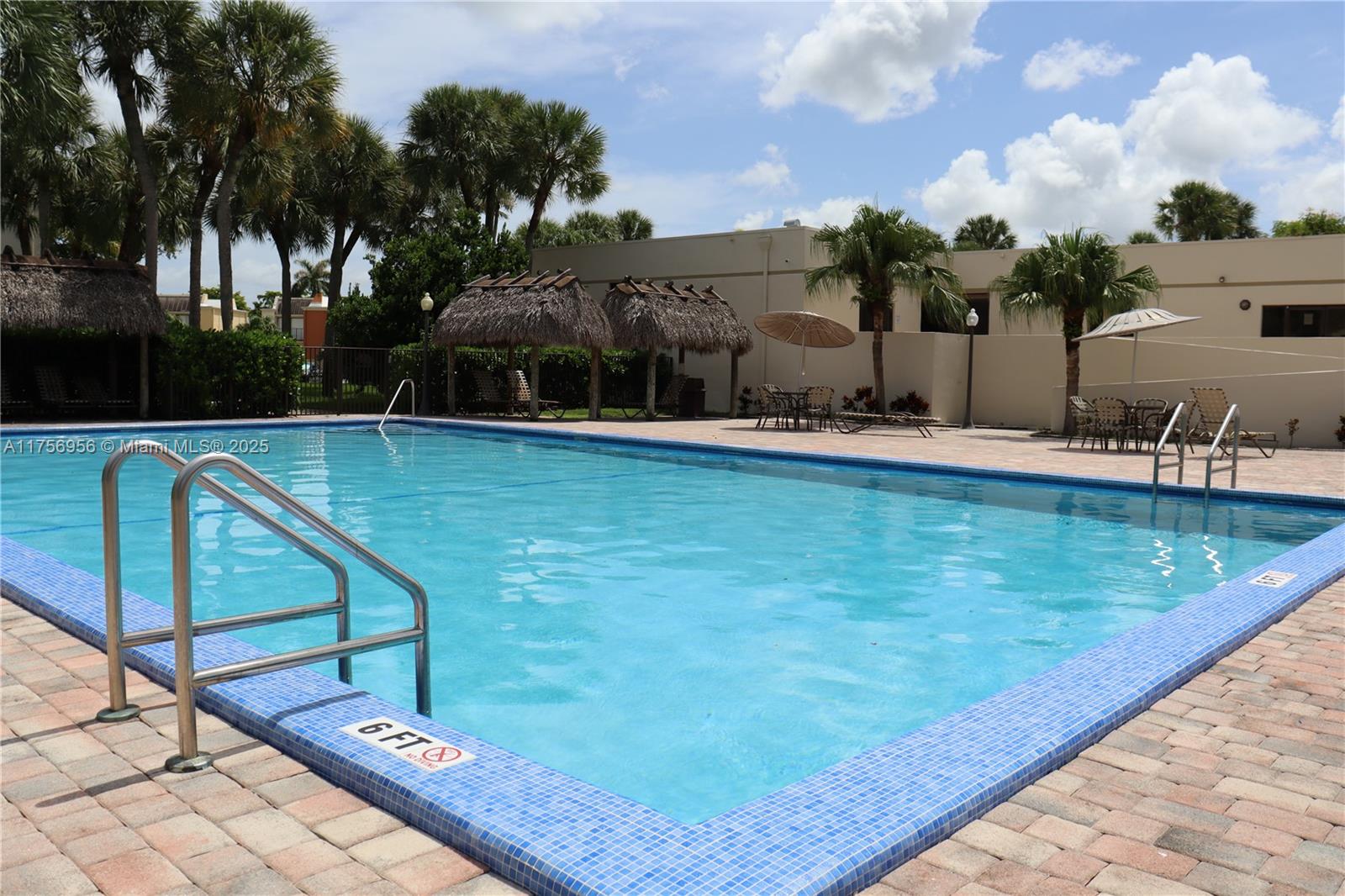 8025 Southwest 107th Avenue, Unit 222 Miami, FL 33173 - Photo 17 of 27 a view of a swimming pool with a patio