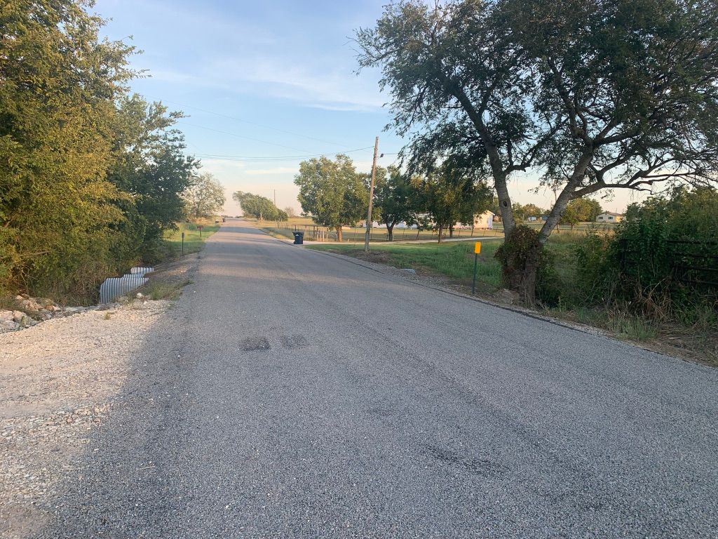 Undisclosed Address Georgetown, TX 78626 - Photo 5 of 9 a view of a road with a trees