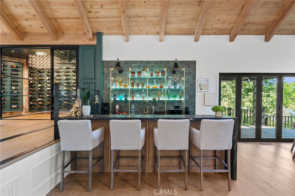 5510 Hoback Glen Road Hidden Hills, CA 91302 - Photo 12 of 60 a dining room with furniture and wooden floor