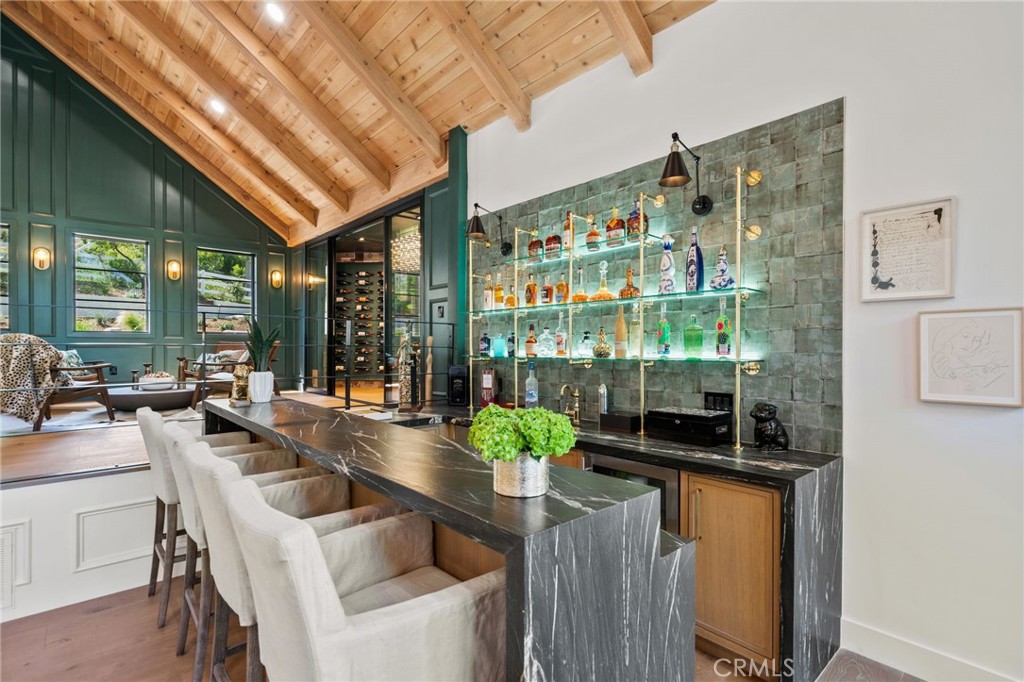 5510 Hoback Glen Road Hidden Hills, CA 91302 - Photo 13 of 60 a dining room with furniture a livingroom and chandelier