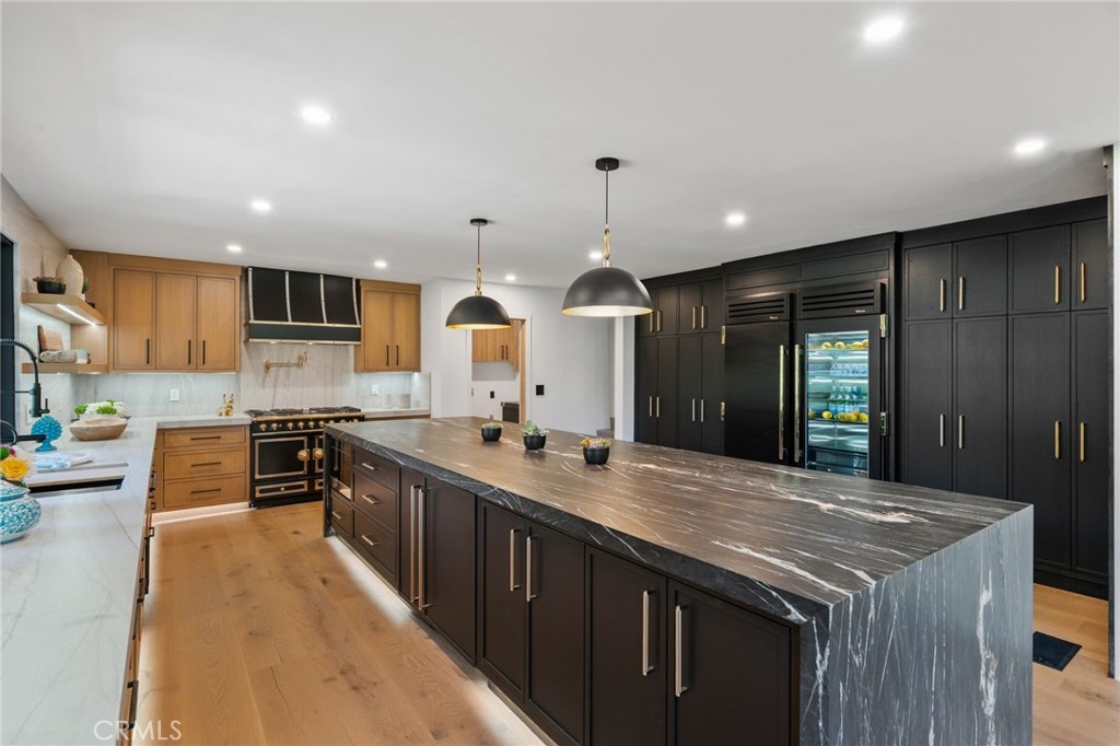5510 Hoback Glen Road Hidden Hills, CA 91302 - Photo 24 of 60 a kitchen with stainless steel appliances granite countertop a sink stove and cabinets