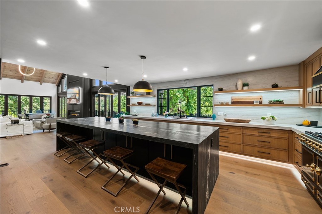 5510 Hoback Glen Road Hidden Hills, CA 91302 - Photo 26 of 60 a kitchen with counter top space cabinets and outdoor space
