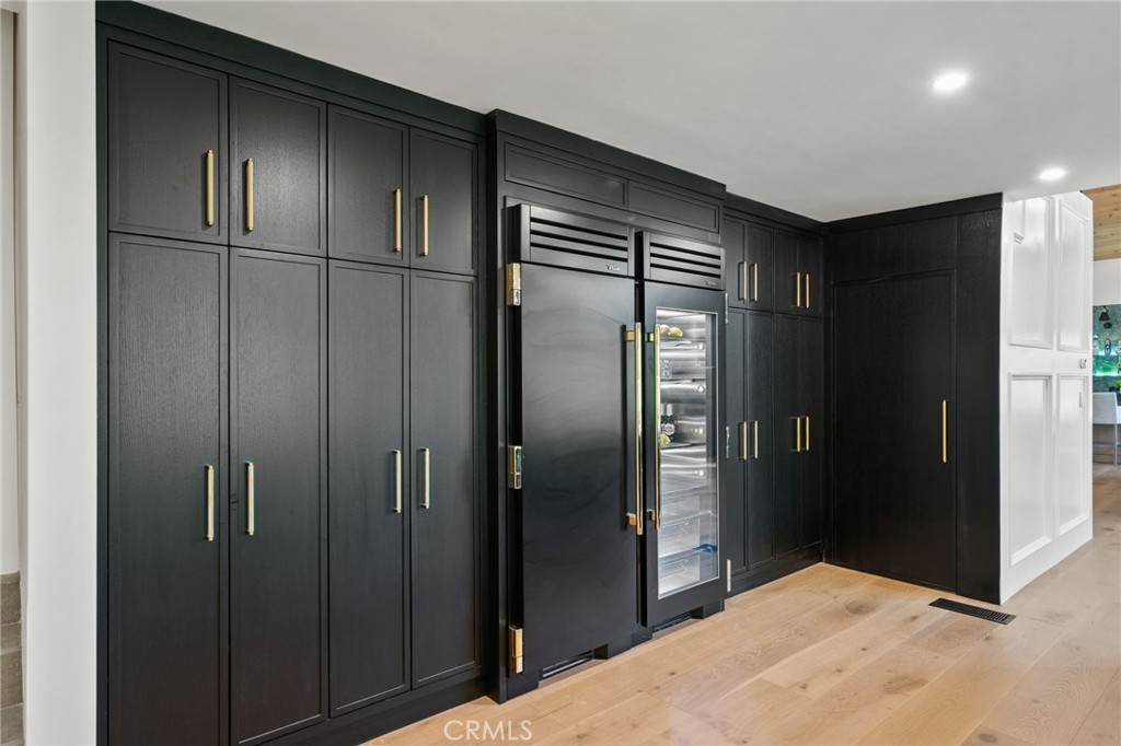 5510 Hoback Glen Road Hidden Hills, CA 91302 - Photo 27 of 60 a kitchen with stainless steel appliances kitchen island a refrigerator and a sink