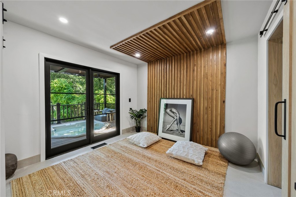 5510 Hoback Glen Road Hidden Hills, CA 91302 - Photo 28 of 60 a bedroom with a bed and a large window