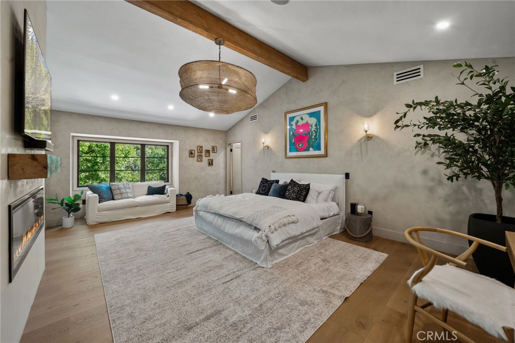 5510 Hoback Glen Road Hidden Hills, CA 91302 - Photo 30 of 60 a spacious bedroom with a large bed and a couch