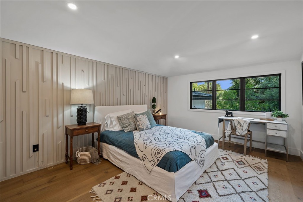 5510 Hoback Glen Road Hidden Hills, CA 91302 - Photo 39 of 60 a bed room with a bed and a table