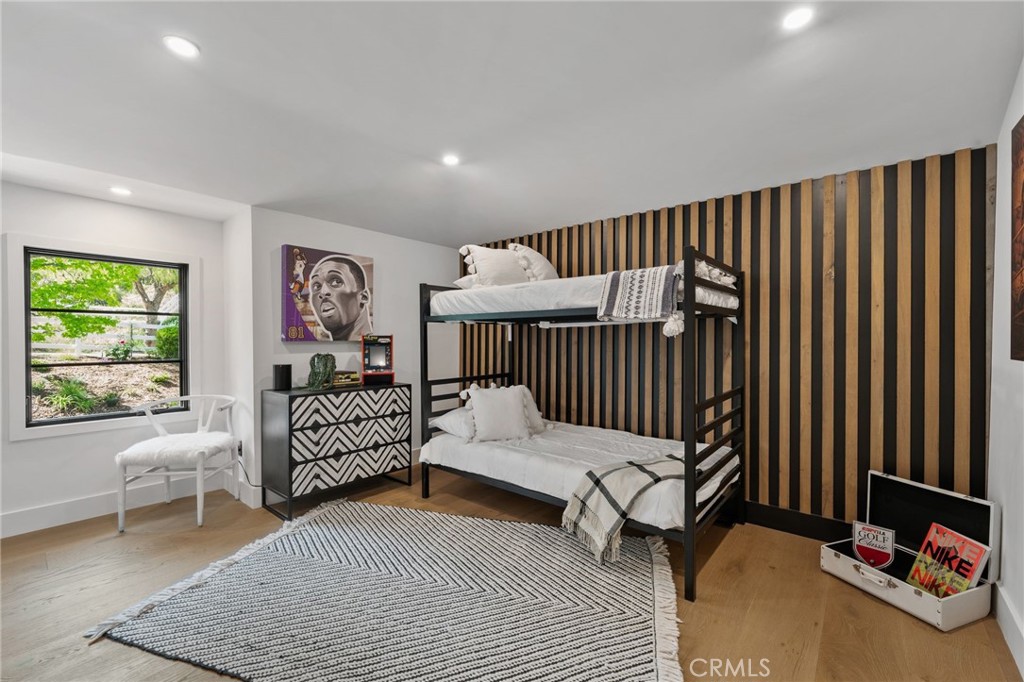 5510 Hoback Glen Road Hidden Hills, CA 91302 - Photo 41 of 60 a bedroom with furniture and a window