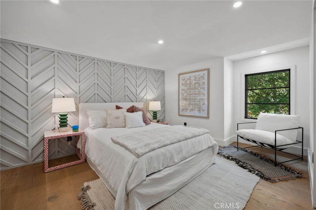 5510 Hoback Glen Road Hidden Hills, CA 91302 - Photo 44 of 60 a bedroom with a large bed and a window