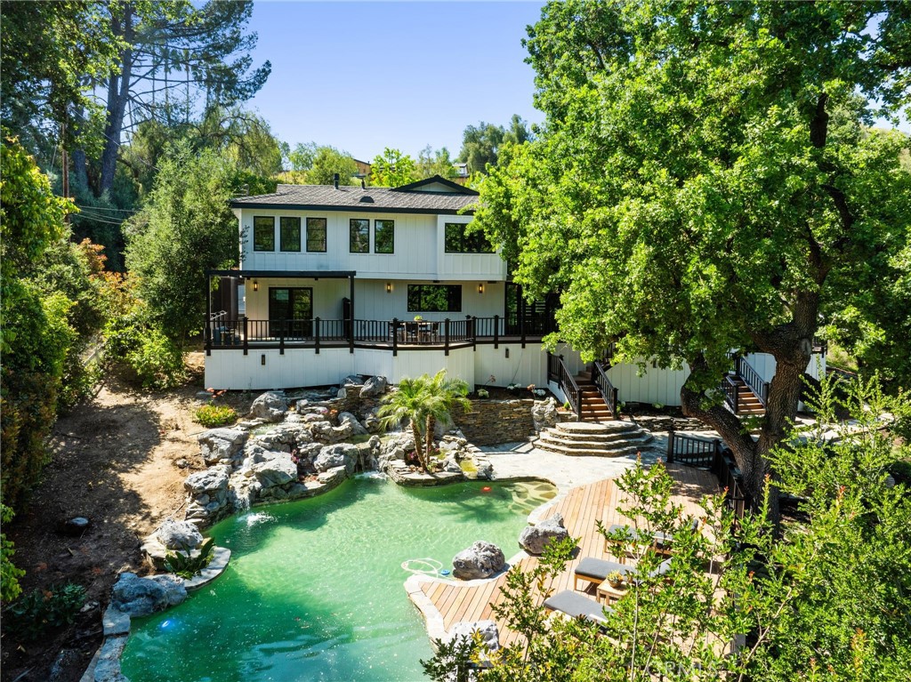 5510 Hoback Glen Road Hidden Hills, CA 91302 - Photo 56 of 60 a view of a house with swimming pool and sitting area