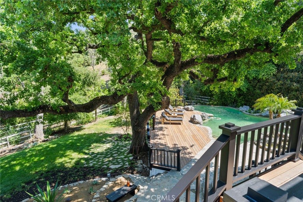 5510 Hoback Glen Road Hidden Hills, CA 91302 - Photo 57 of 60 a view of a pathway of a house with wooden fence