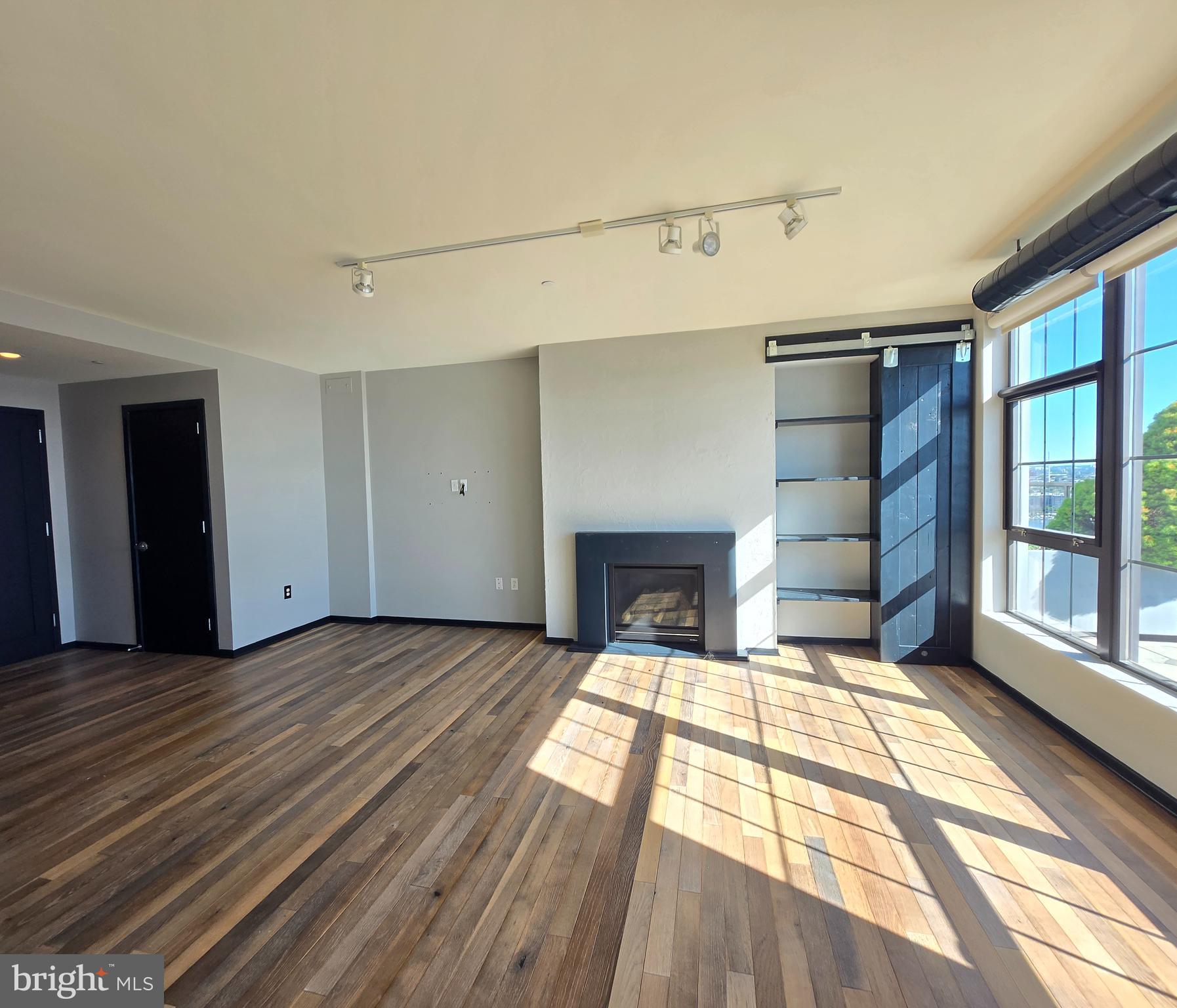 1200 Steuart Street, Unit 1913 Baltimore, MD 21230 - Photo 7 of 57 Sleek fireplace wall.