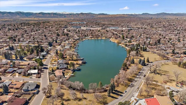 an aerial view of a house with a lake view