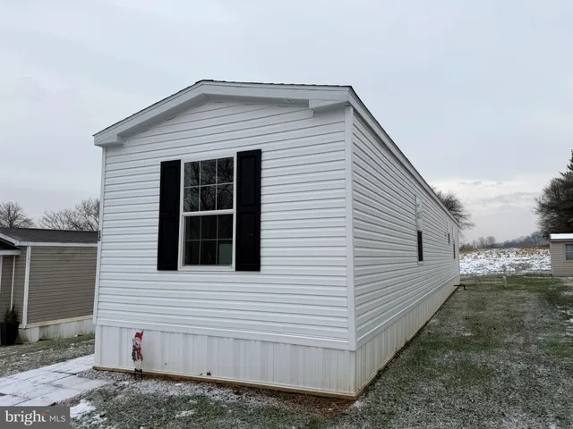a view of a small white house