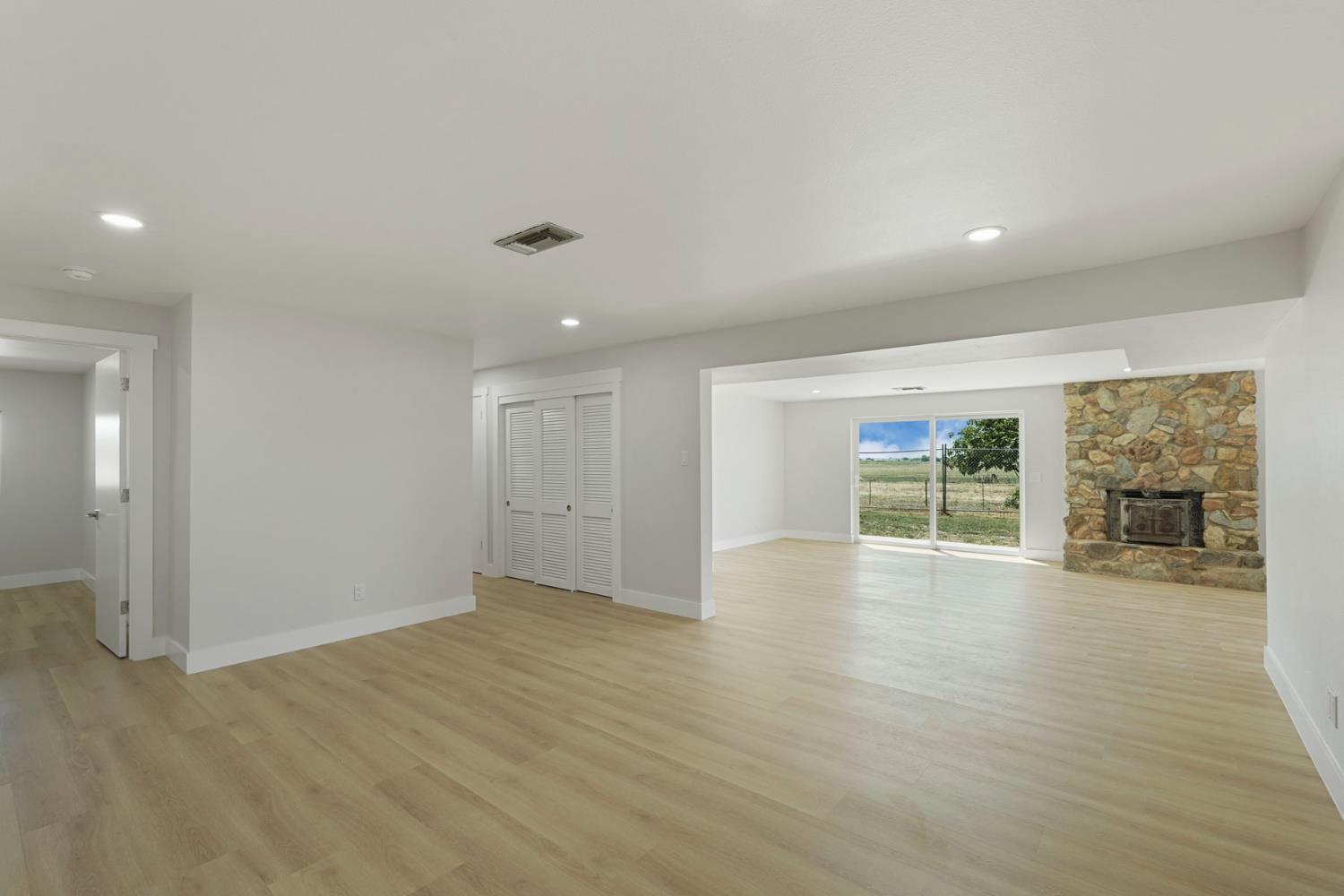 2650 West Twitchell Island Road Rio Vista, CA 94571 - Photo 47 of 60 an empty room with wooden floor and windows