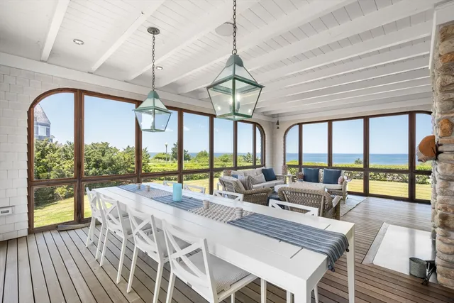 a very nice looking room with a large window and dining table