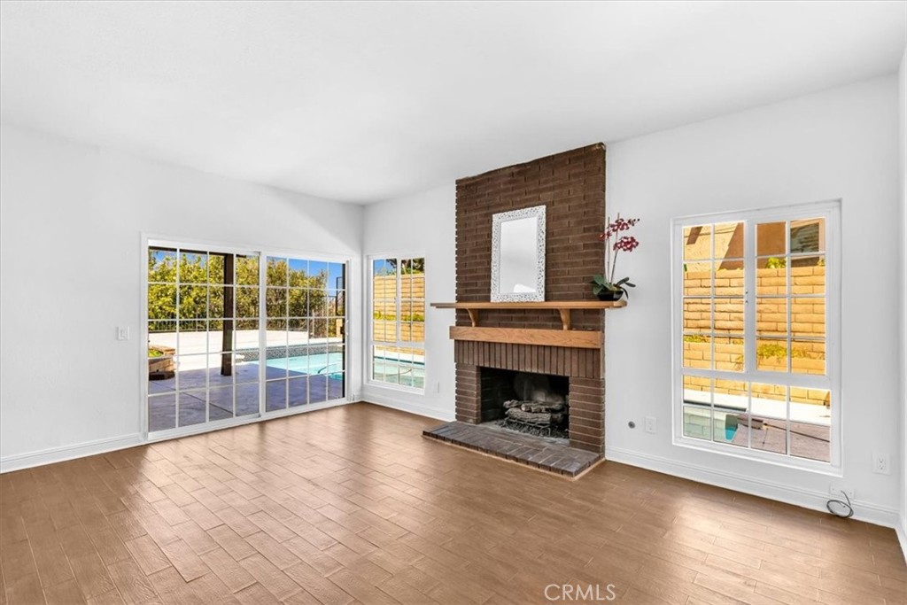3315 Hawkwood Road Diamond Bar, CA 91765 - Photo 23 of 64 Main floor den w fireplace and slider to the pool