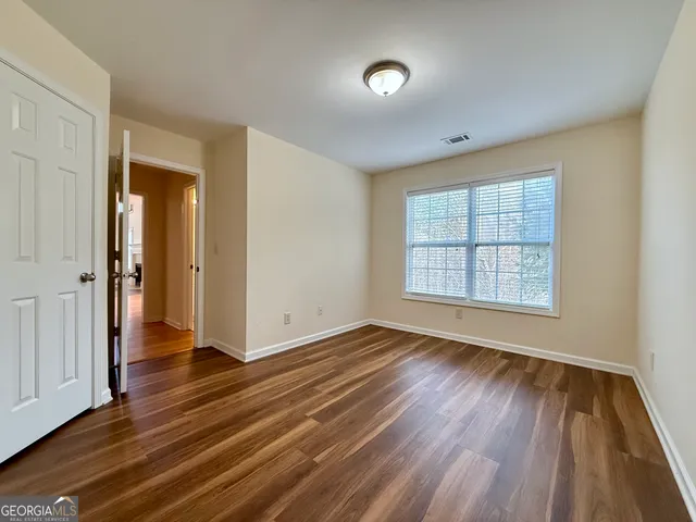 a white toilet sitting next to a bath tub