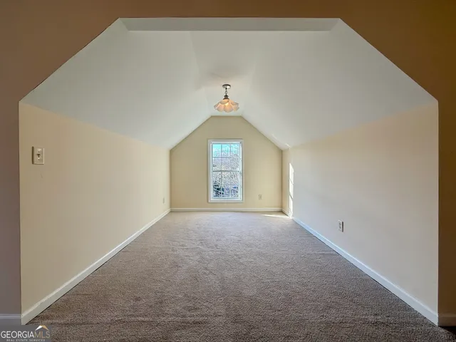 a spacious bathroom with a bathtub and a toilet