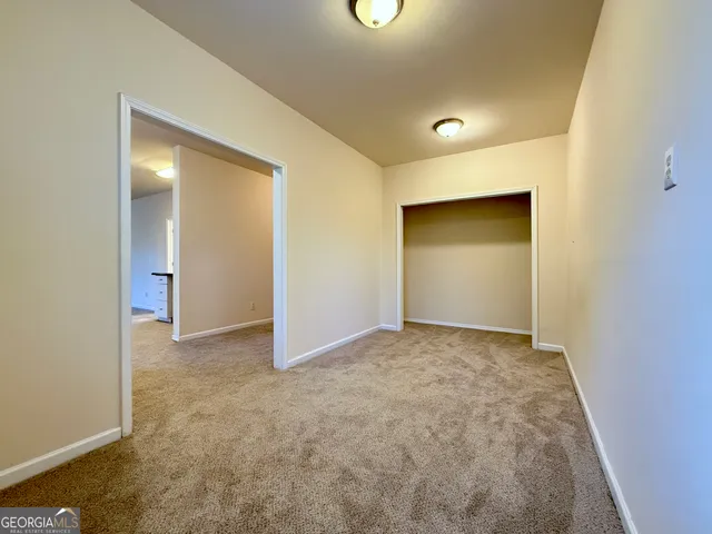 a view of a backyard with a wooden fence