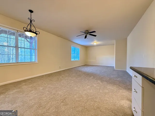 a view of a chairs and tables in the patio