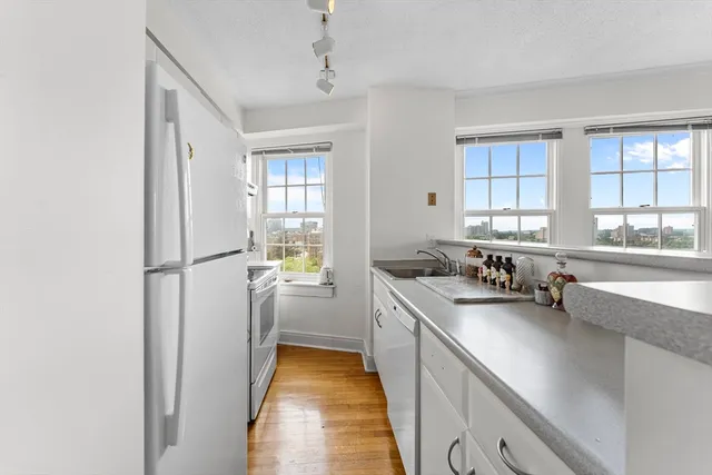 a kitchen with sink cabinets and window