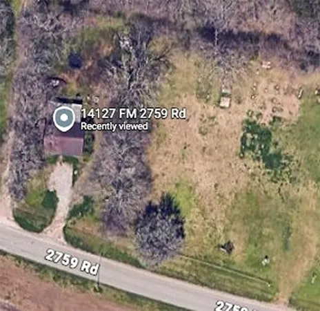 a sign that is on a brick wall