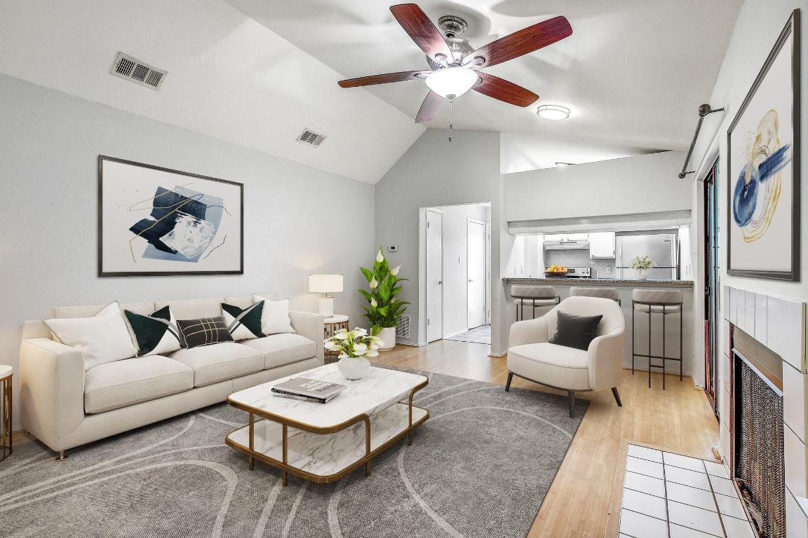 2215 Post Road, Unit 2022 Austin, TX 78704 - Photo 5 of 15 a living room with furniture a rug and a chandelier