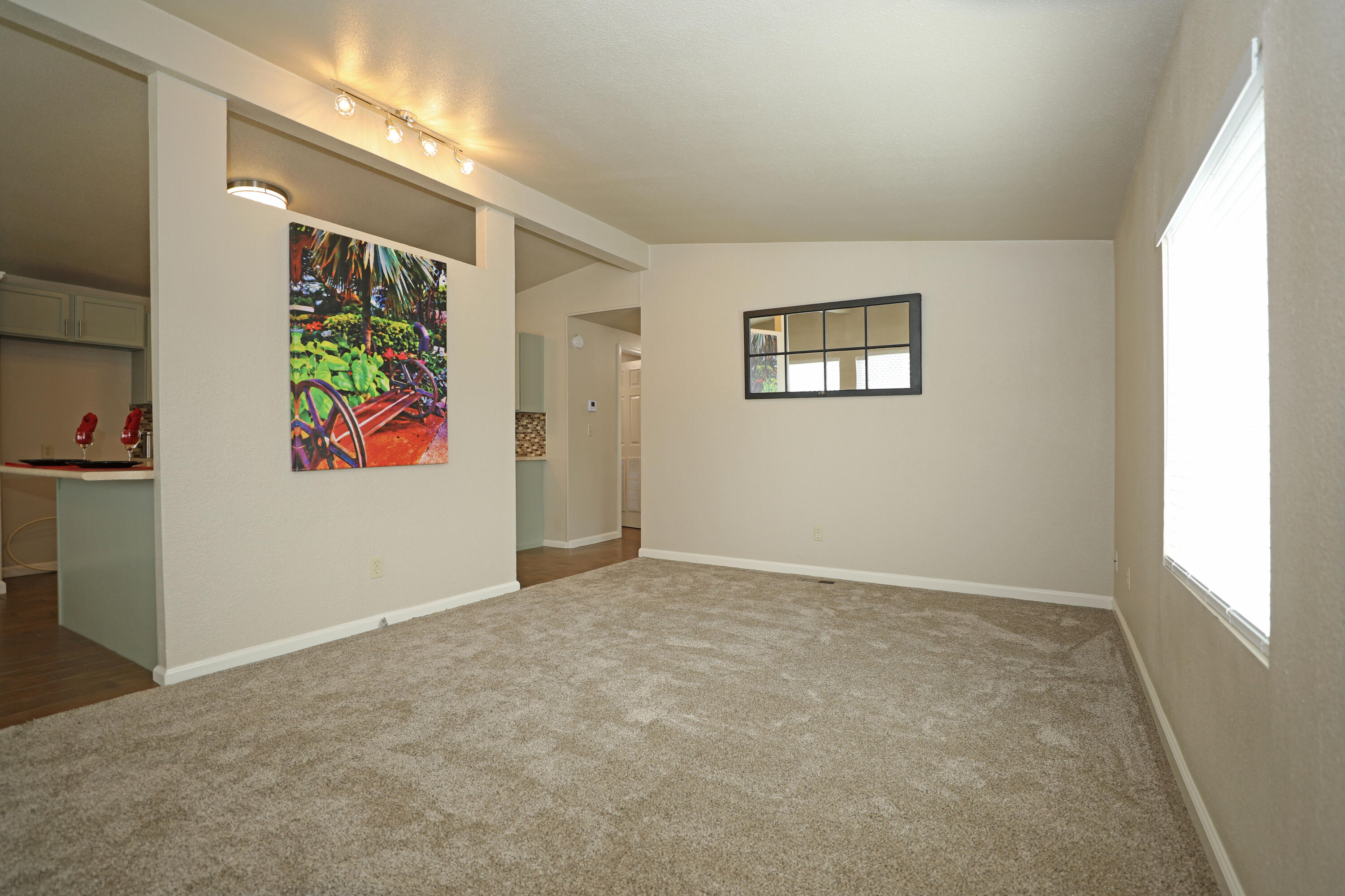 1183 Fox Den Drive Redding, CA 96003 - Photo 2 of 17 an empty room with windows and entrance